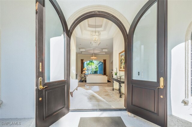 29115 W Teramo Way, Naples, FL 34110 - foyer with arched walkways and a raised ceiling