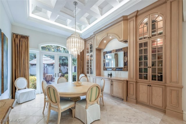 29115 W Teramo Way, Naples, FL 34110 - dining area featuring beamed ceiling, a notable chandelier, crown molding, coffered ceiling, and a towering ceiling
