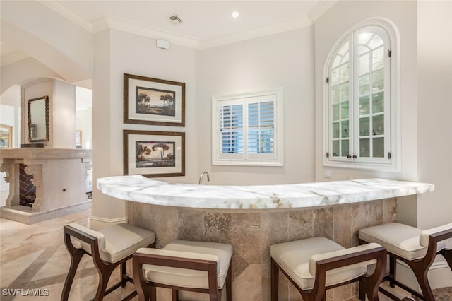 29115 W Teramo Way, Naples, FL 34110 - bar with recessed lighting, arched walkways, indoor wet bar, ornamental molding, and visible vents