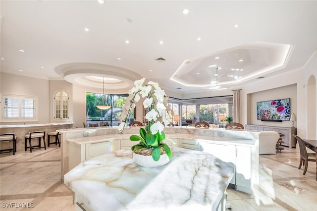 29115 W Teramo Way, Naples, FL 34110 - dining area featuring a wealth of natural light, crown molding, and a tray ceiling