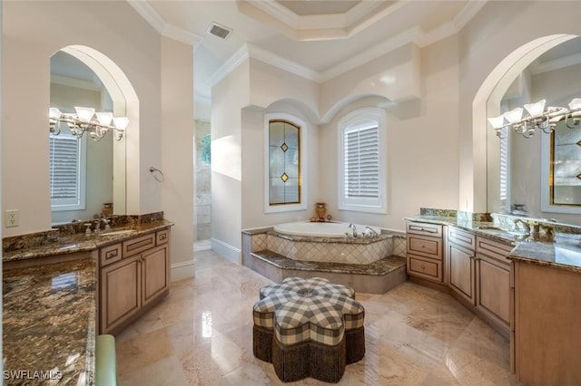 29115 W Teramo Way, Naples, FL 34110 - bathroom with ornamental molding, a notable chandelier, a garden tub, and two vanities