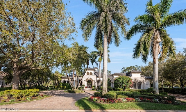 view of front of house with decorative driveway