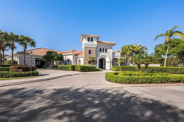 29115 W Teramo Way, Naples, FL 34110 - view of building exterior with curved driveway