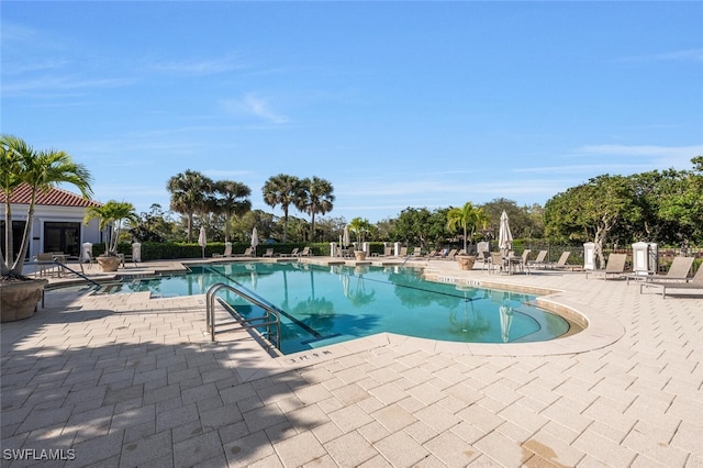 29115 W Teramo Way, Naples, FL 34110 - community pool featuring a patio area