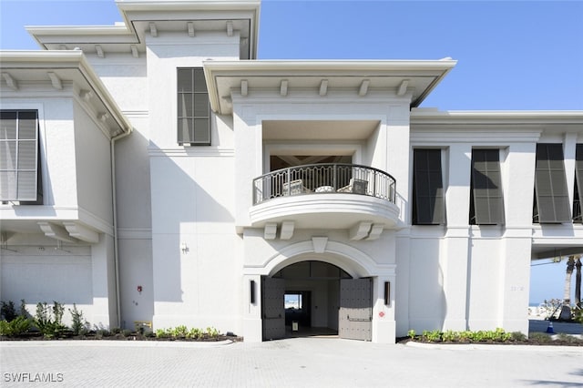 29115 W Teramo Way, Naples, FL 34110 - exterior space featuring stucco siding and a balcony
