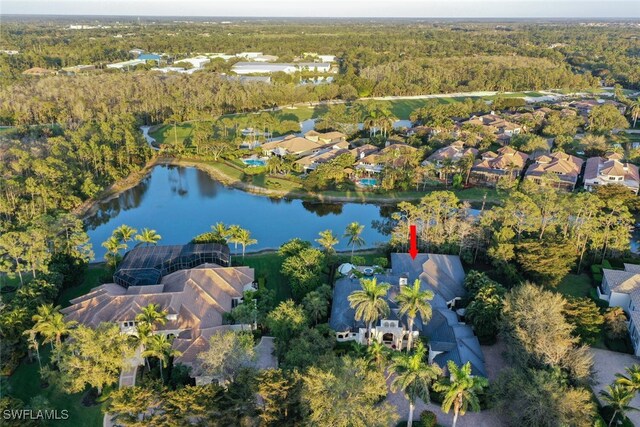 bird's eye view featuring a residential view, a view of trees, and a water view