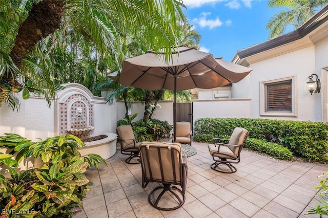 29115 W Teramo Way, Naples, FL 34110 - view of patio featuring a gate and a fenced backyard