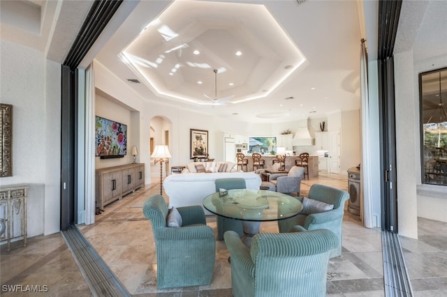29115 W Teramo Way, Naples, FL 34110 - dining room with visible vents, recessed lighting, a tray ceiling, and arched walkways