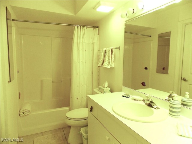 bathroom with tile patterned flooring, vanity, toilet, and shower / tub combo