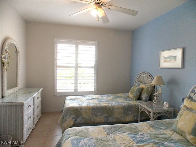 bedroom with light tile patterned flooring and a ceiling fan