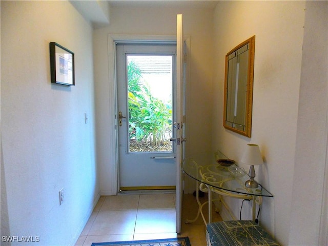 doorway to outside featuring plenty of natural light and light tile patterned floors