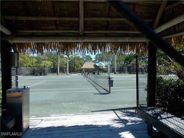 view of sport court with fence