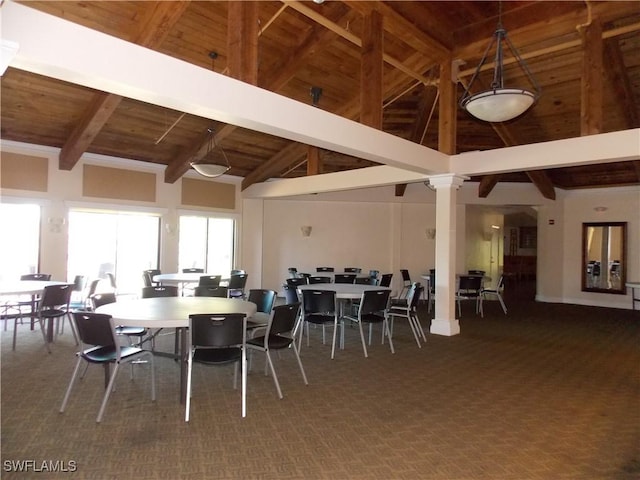 dining space featuring wooden ceiling, high vaulted ceiling, carpet flooring, and beam ceiling