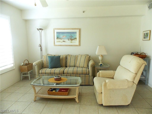 living room with light tile patterned floors and a ceiling fan