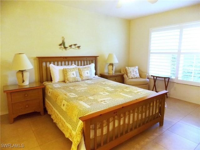 bedroom with tile patterned floors and ceiling fan