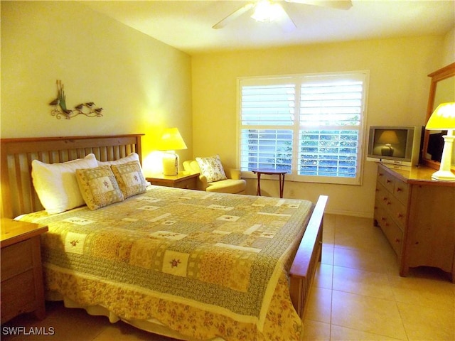 bedroom featuring light tile patterned floors and ceiling fan