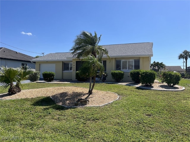 ranch-style house featuring stucco siding, an attached garage, and a front yard