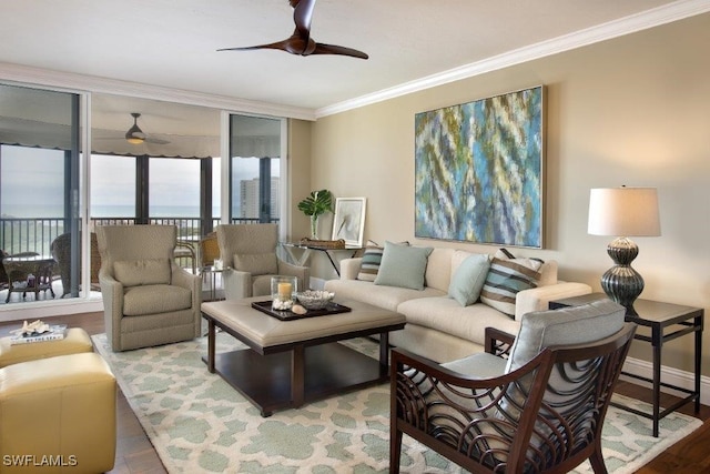 living area featuring a wall of windows, crown molding, ceiling fan, and wood finished floors