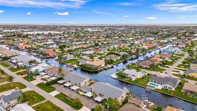 bird's eye view with a residential view and a water view