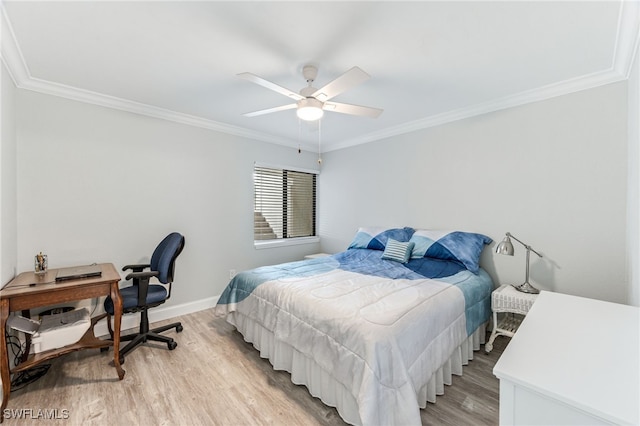 bedroom featuring ceiling fan, light wood-style floors, baseboards, and ornamental molding