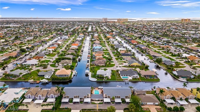 drone / aerial view with a residential view and a water view