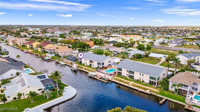 bird's eye view with a residential view and a water view