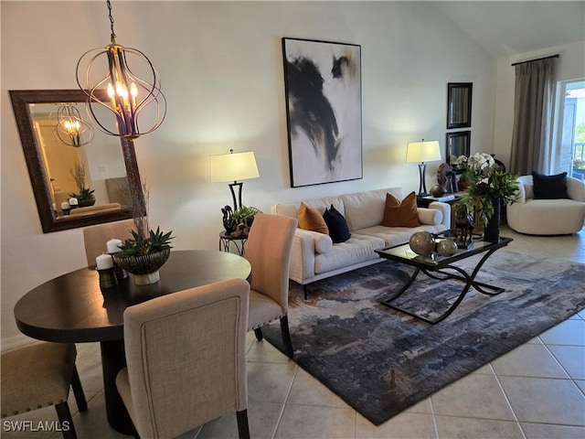 tiled living area featuring a notable chandelier and vaulted ceiling