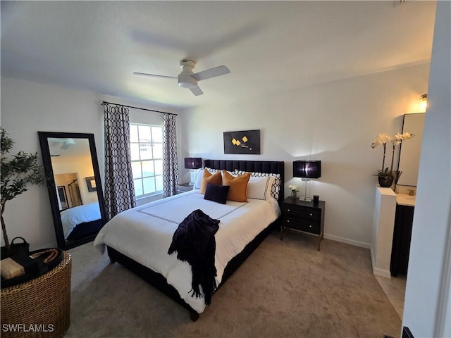 bedroom with baseboards, a ceiling fan, and carpet floors