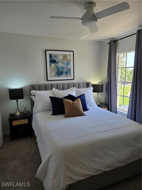 carpeted bedroom with a ceiling fan