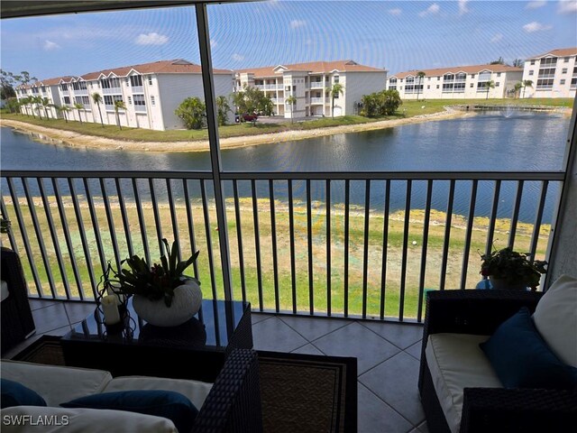 balcony with a water view and a residential view