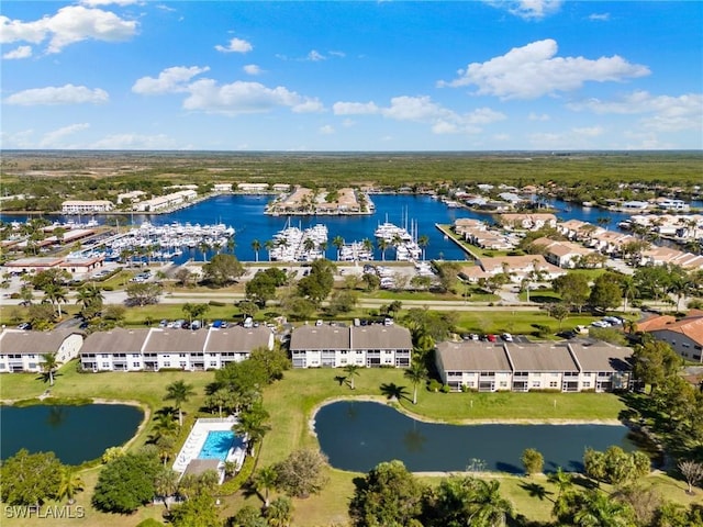 aerial view with a residential view and a water view