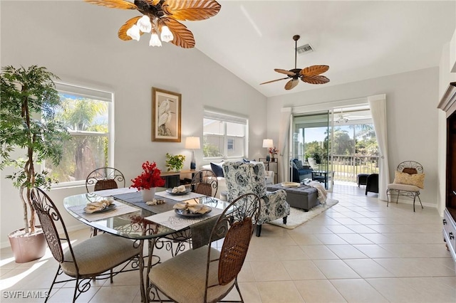 dining area with visible vents, baseboards, ceiling fan, lofted ceiling, and light tile patterned floors