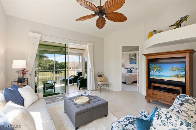 living room featuring light tile patterned floors and a ceiling fan