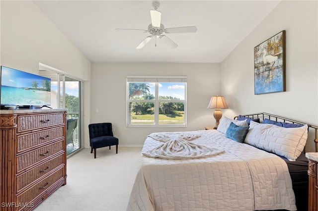 carpeted bedroom featuring access to exterior, a ceiling fan, baseboards, and lofted ceiling