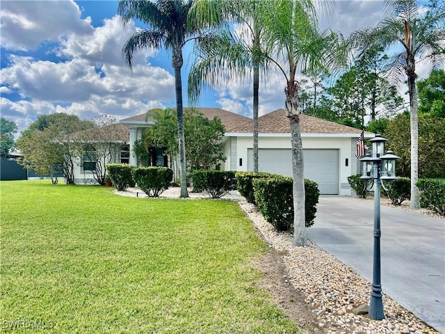 ranch-style home with a garage, concrete driveway, a front lawn, and stucco siding