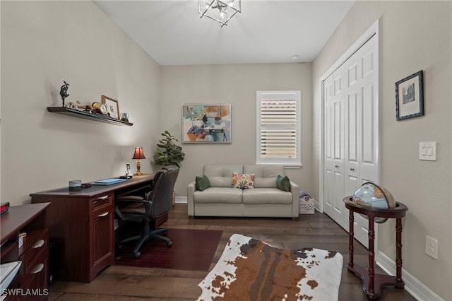 home office featuring baseboards and wood finished floors