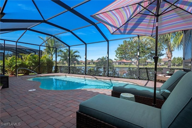 pool featuring a patio area and glass enclosure