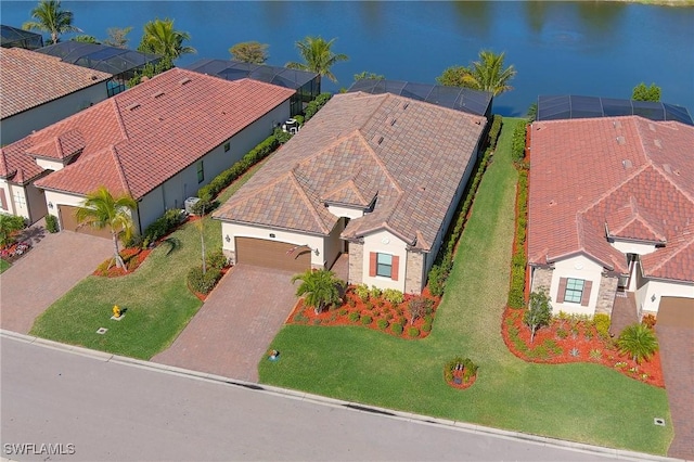 bird's eye view with a residential view and a water view