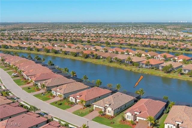 aerial view featuring a residential view and a water view