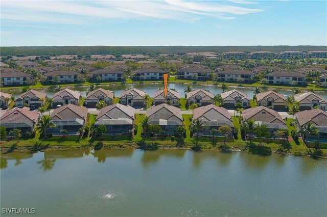 aerial view with a residential view and a water view