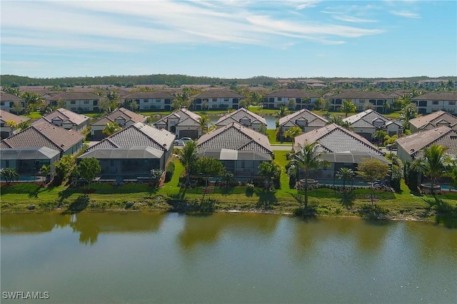 bird's eye view featuring a residential view and a water view