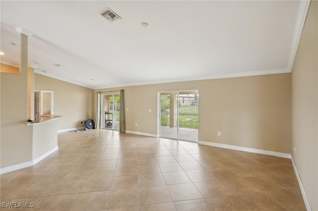 unfurnished room with light tile patterned floors, baseboards, visible vents, vaulted ceiling, and crown molding