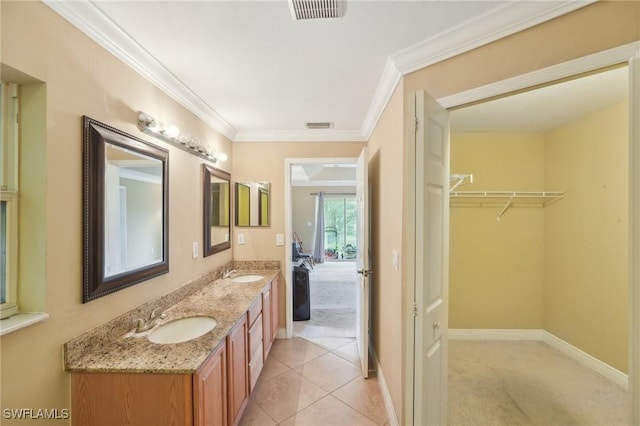 full bathroom featuring double vanity, visible vents, crown molding, and a sink