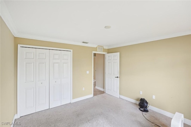 unfurnished bedroom featuring carpet, visible vents, and baseboards