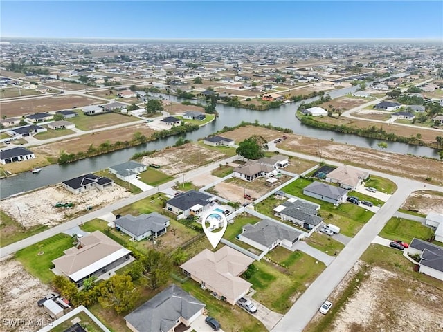 bird's eye view with a residential view and a water view