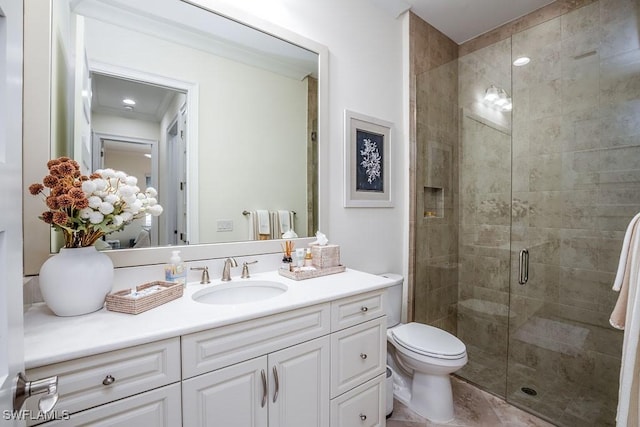 full bath featuring toilet, a stall shower, and vanity