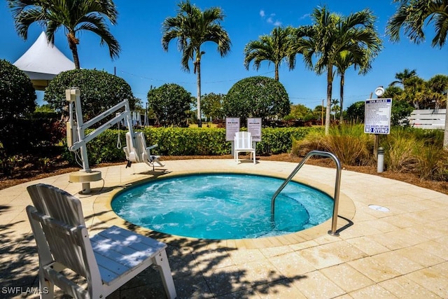 view of swimming pool with a patio area