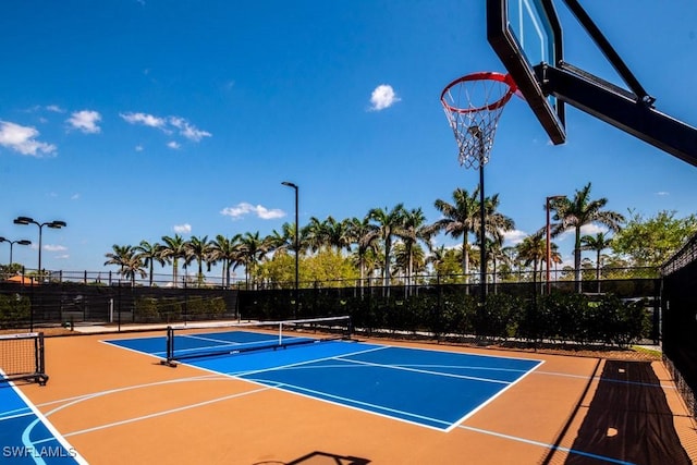 view of sport court featuring community basketball court and fence