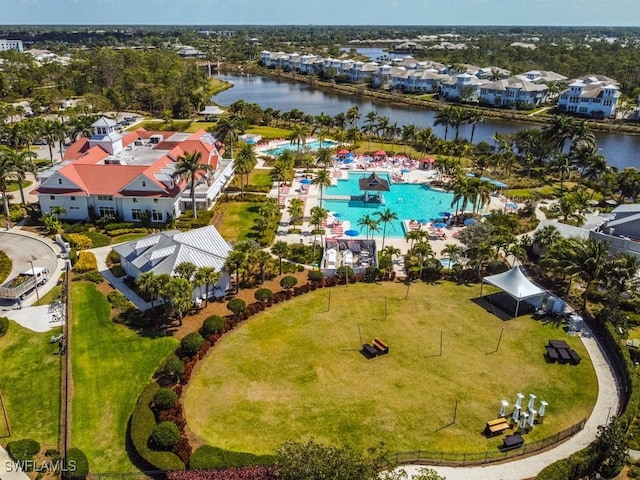 drone / aerial view with a residential view and a water view