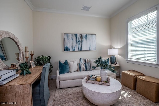 living area featuring visible vents, crown molding, and baseboards